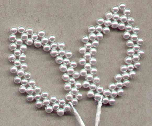 Shear leaves with pearl edging for corsages, floral arrangements, wedding decorations, providing an elegant accent.