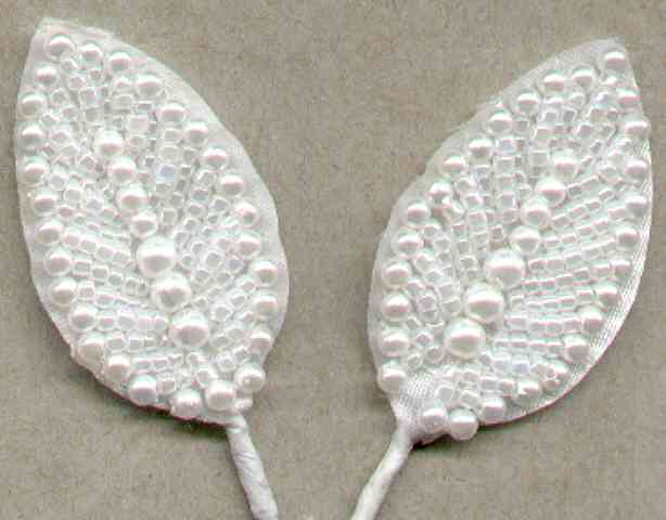 Shear leaves with pearl edging for corsages, floral arrangements, wedding decorations, providing an elegant accent.
