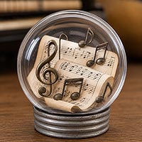Music-themed fillable ornament featuring sheet music and musical notes for musicians, band students, and music room d�cor.