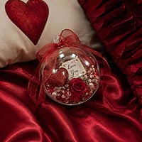 Valentine's Day fillable ornament craft idea featuring conversation hearts and pink decorations for romantic gifts and holiday home d�cor.