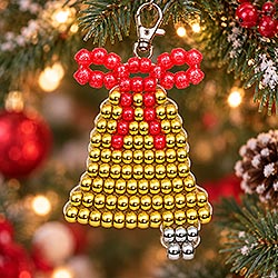 Beaded pony bead DIY Christmas ornament hanging on a decorated Christmas tree